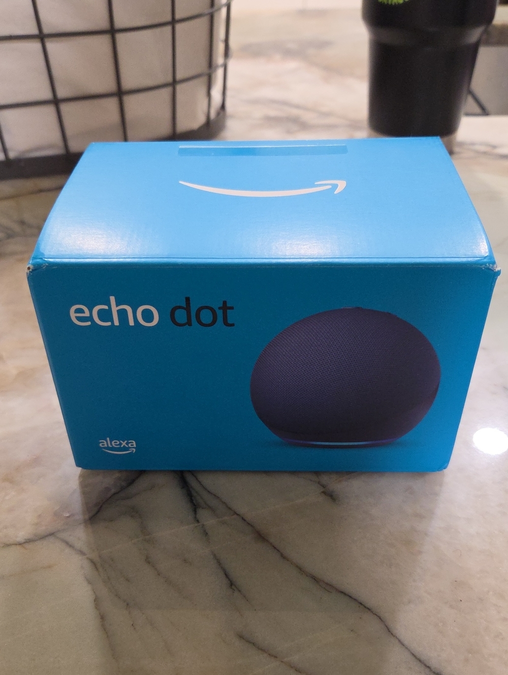 Amazon Echo Dot Smart Speaker in Bright Blue Packaging with Dark Navy Device